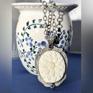 Sterling silver/amethyst shell ornate “cameo” style necklace.